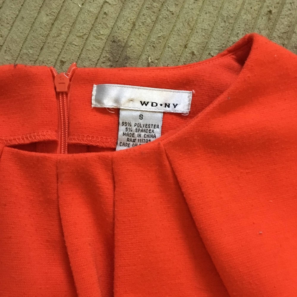 Bright coral blouse.